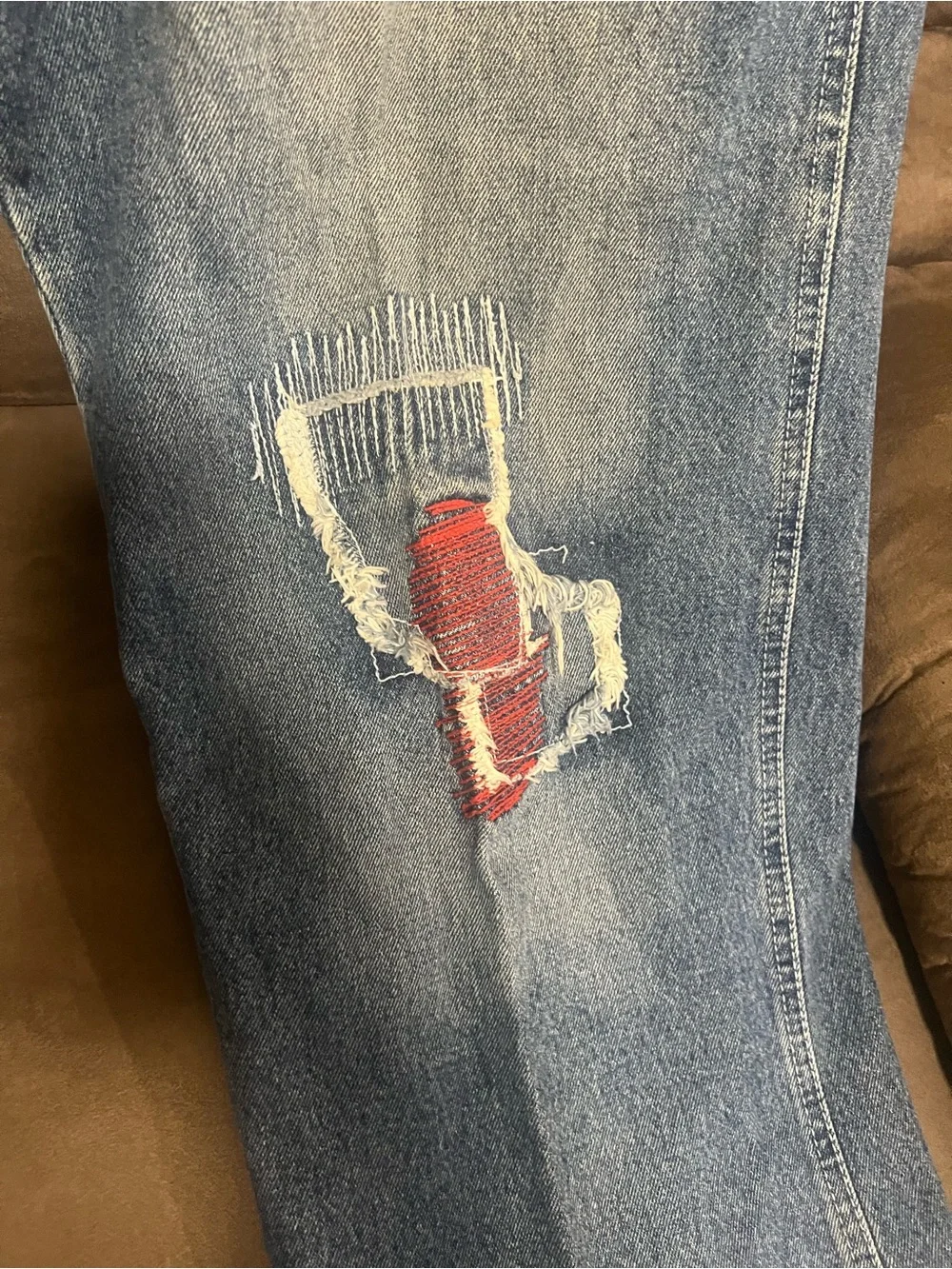 Men's Distressed Blue Jeans with Patch Detail